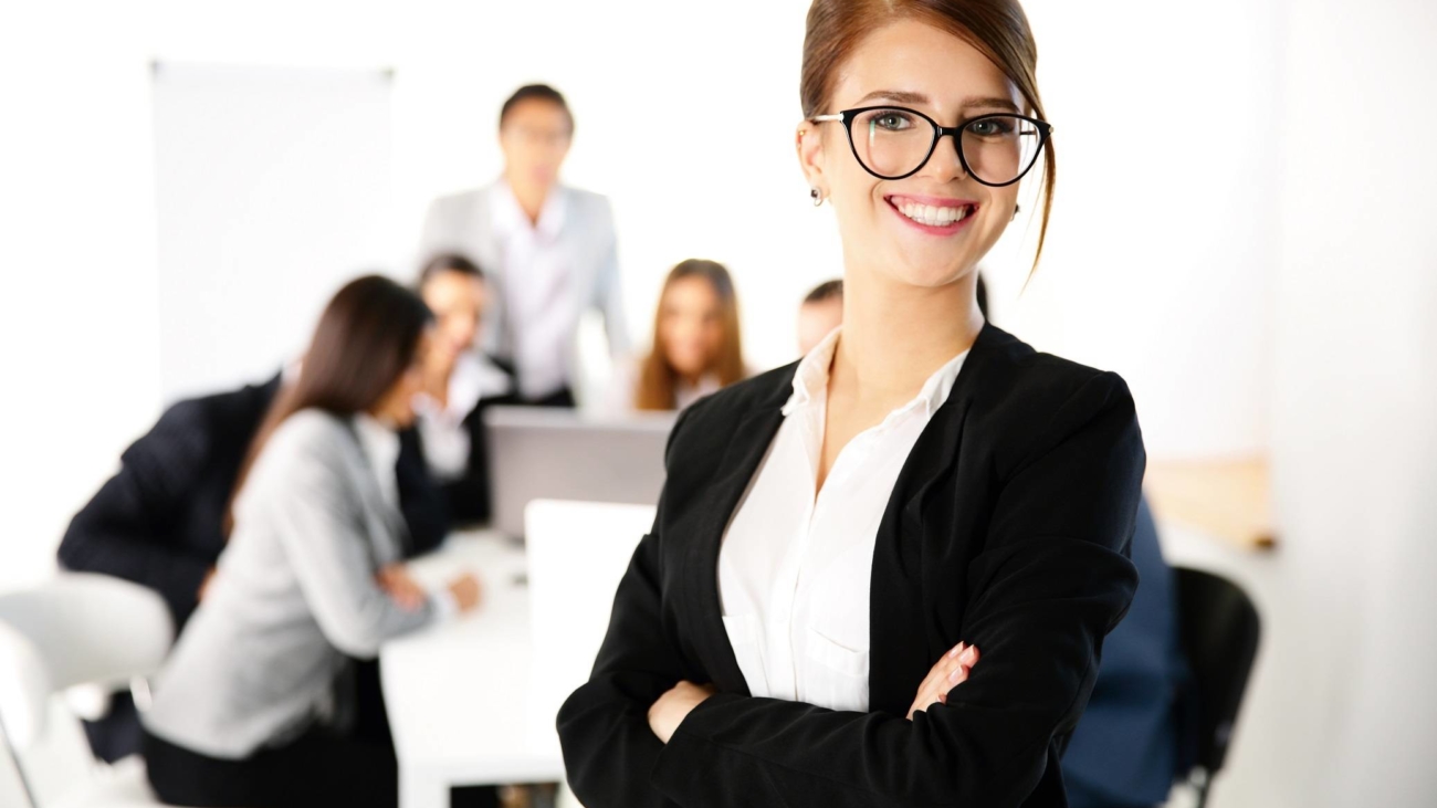 Portrait of a businesswoman standing in front of a business meeting
