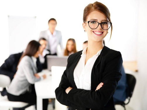 Portrait of a businesswoman standing in front of a business meeting